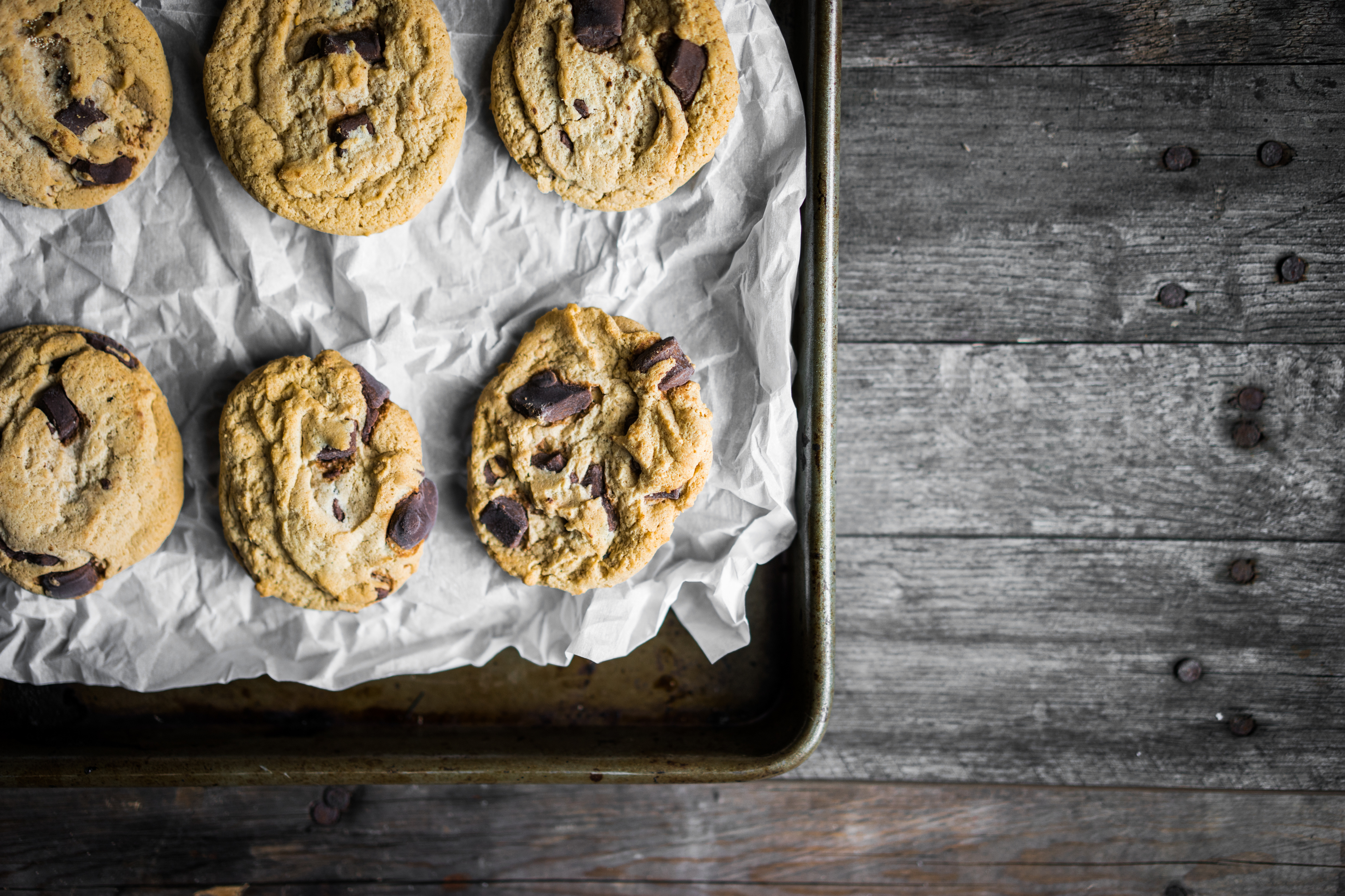 Chocolate chip cookies on rustic background